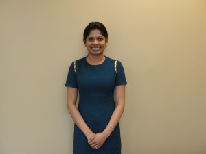 Dr. Nayak in front of a blank wall