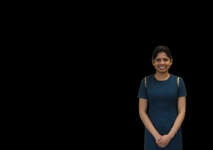 Dr. Nayak, with the background wall digitally removed, and her image placed on a plain, black background.